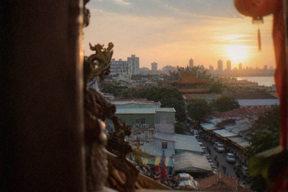 View over Tainan's old city rooftops toward temples and low buildings