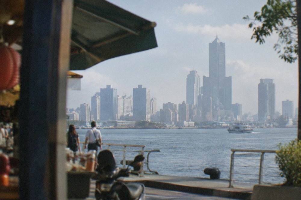 Harbor skyline of Kaohsiung seen across the water on a clear afternoon