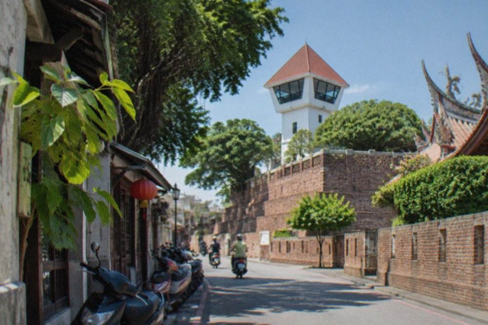 Historic brick walls and a lookout tower at Anping Old Fort under a clear sky