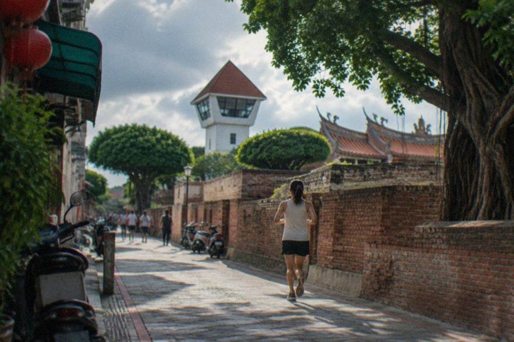 Anping Old Fort's white lookout tower and old brick rampart walls in Tainan
