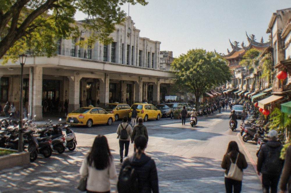 Visitors walking a Tainan old street in warm winter afternoon light