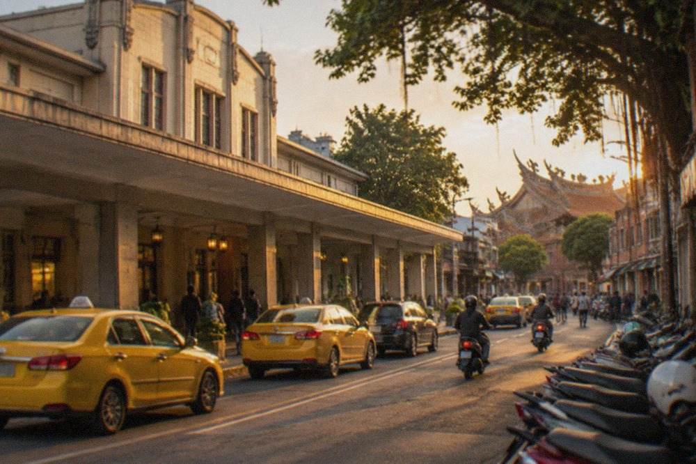 Historic brick buildings along a narrow street in central Tainan at dusk