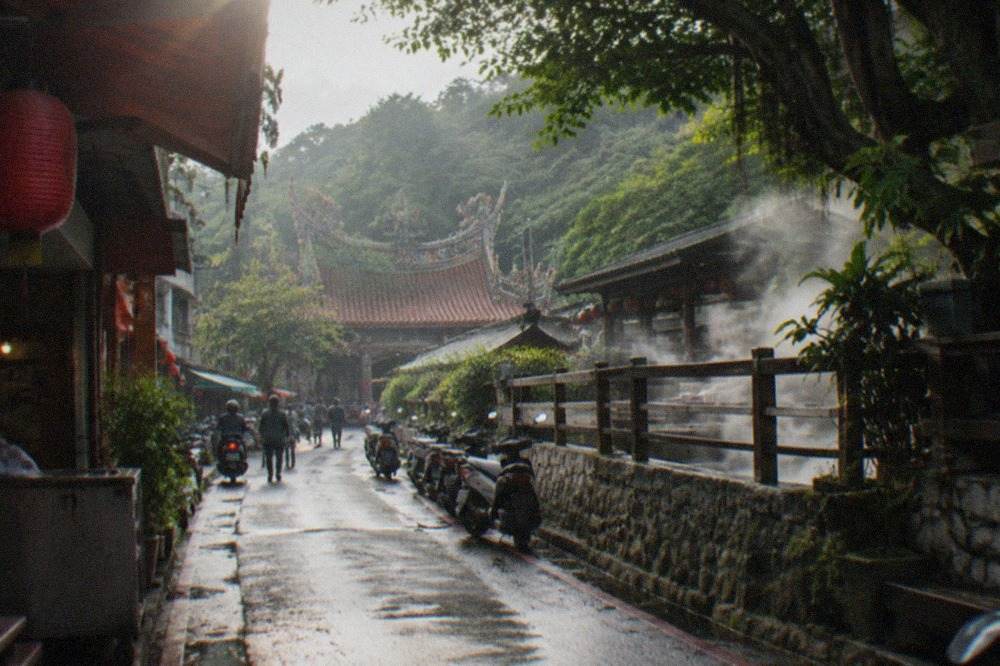 Wooded hillsides above a small hot spring resort town in southern Taiwan
