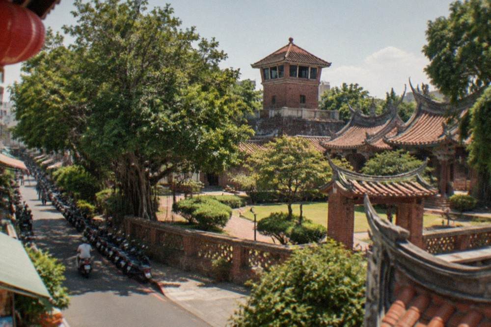 Red brick tower and Chinese pavilions of Chihkan Tower seen across a courtyard