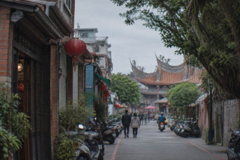 A narrow old street in Anping lined with low brick buildings and small shopfronts
