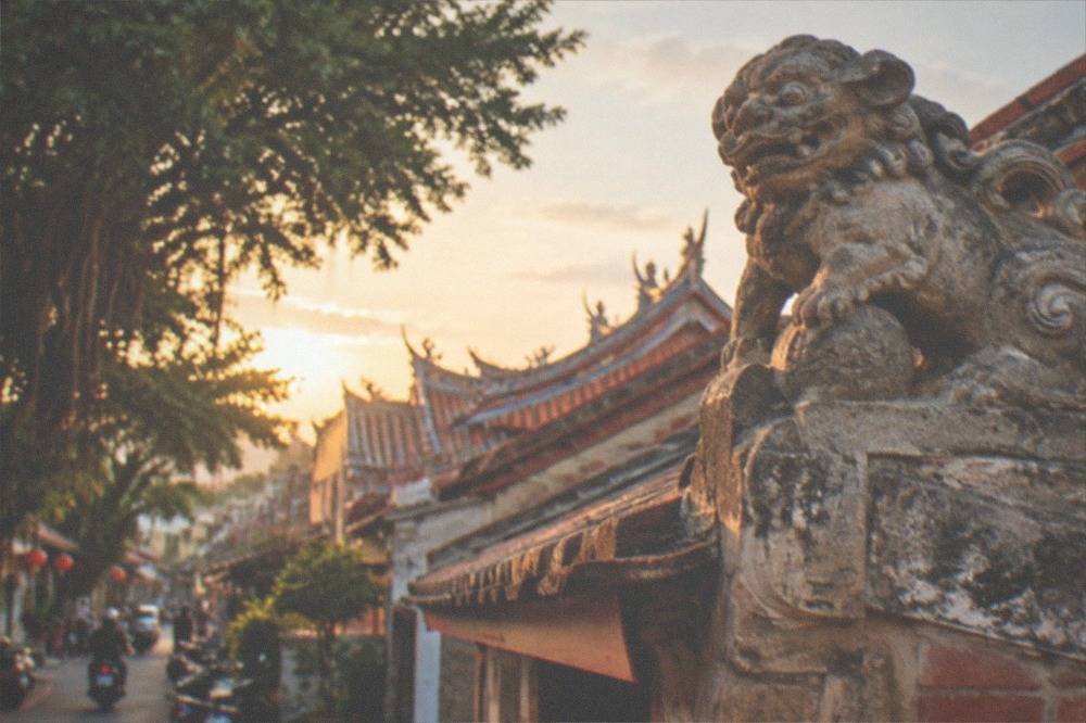 A stone sword lion carved into the gable end of a traditional house in Anping