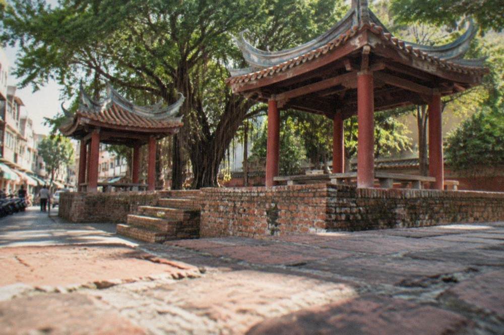 Close view of old Dutch brick foundations supporting later Chinese structures