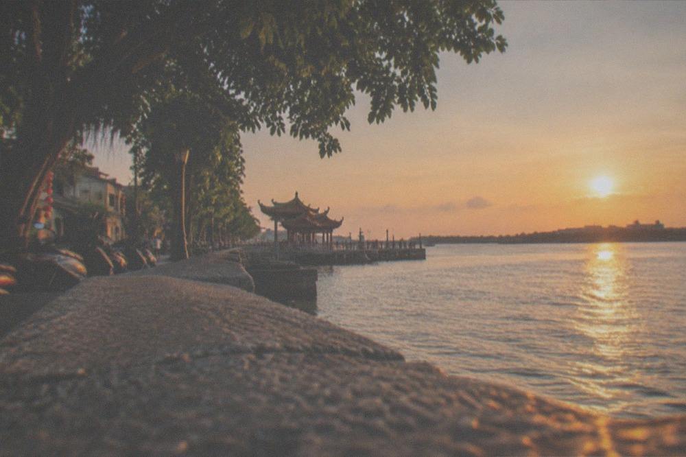 Sunset light over the water at an Anping waterfront park in Tainan