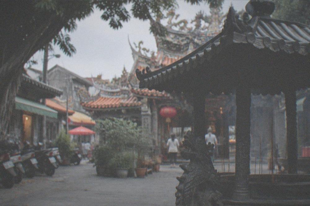 A quiet temple courtyard in warm afternoon light