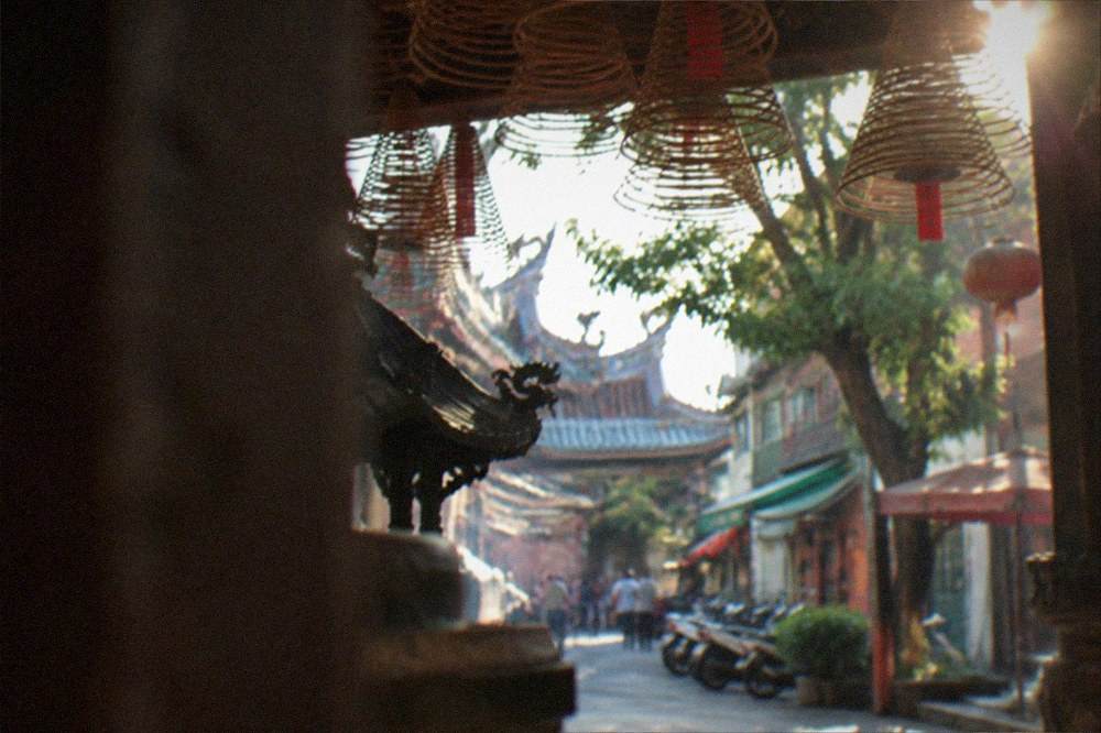 Incense coils hanging under a temple eave