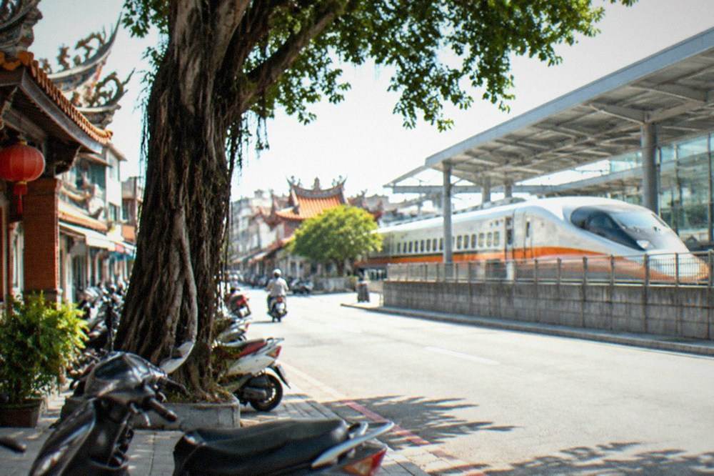 A high speed rail train stopped at a modern station platform in Taiwan