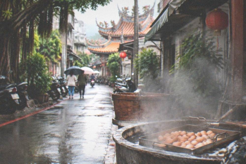 A tray of small hot spring eggs cooking in steaming spring water