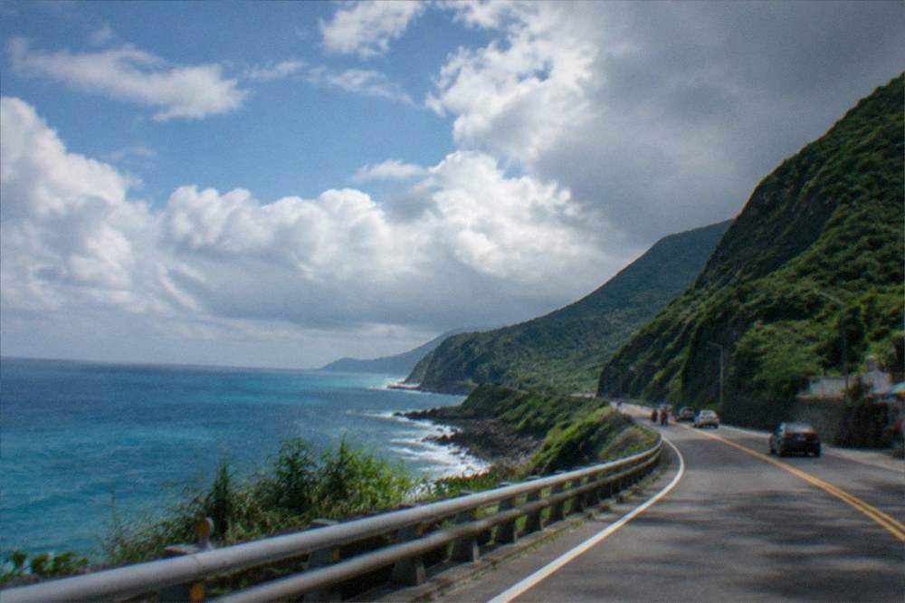 A coastal highway curving along green cliffs toward the southern tip of Taiwan