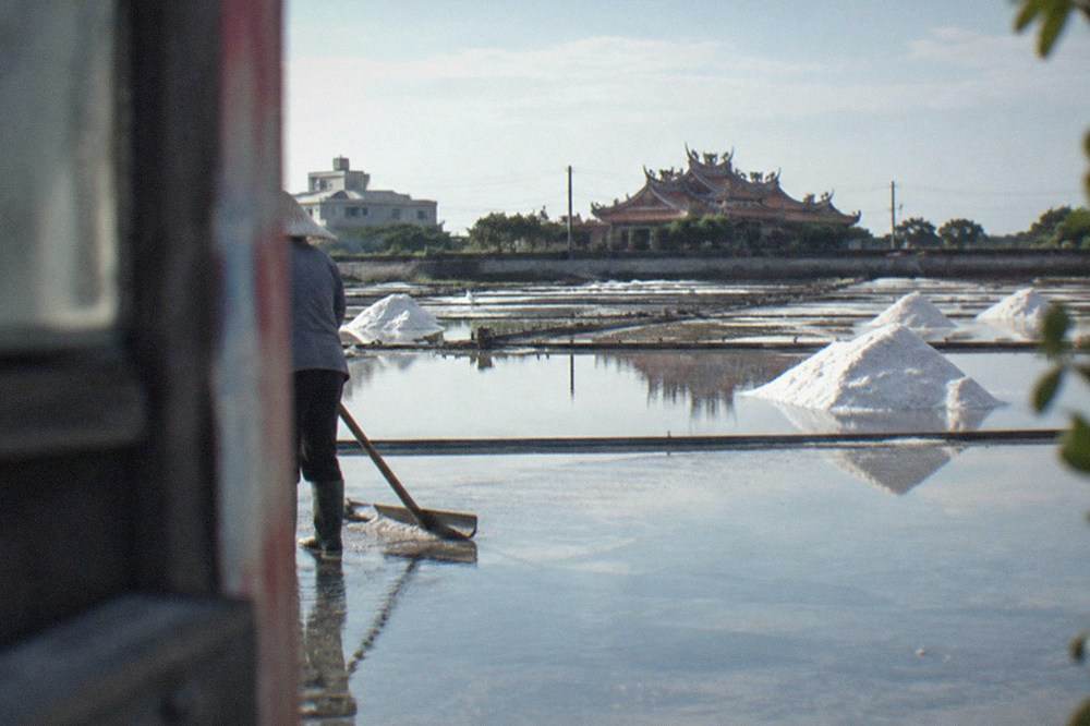 Tile-paved salt evaporation pans reflecting the sky at the Jingzijiao salt fields