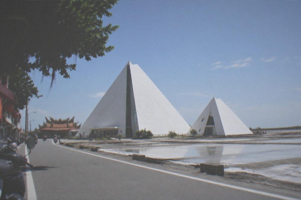 Salt museum building and flat salt pans along the Qigu coastal road