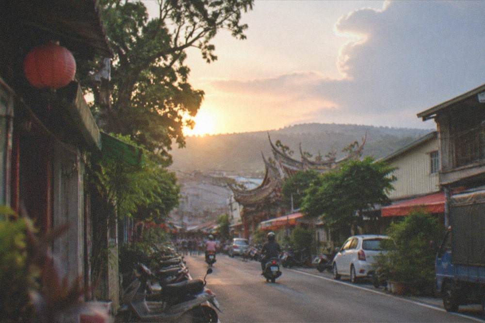 Sunset light over mango orchards and a small town in the Tainan interior hills