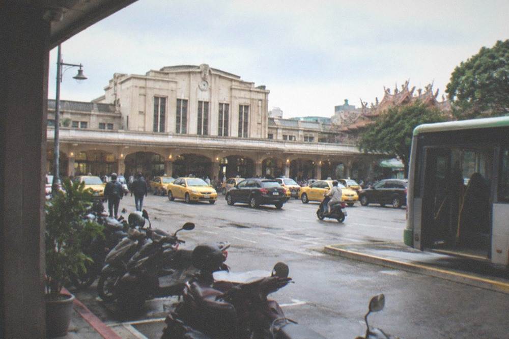 A city bus at a stop with a wide door open and a low curb beside it