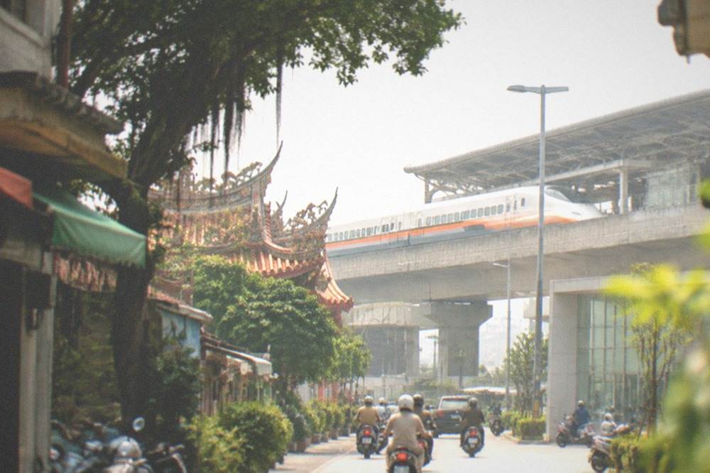 A High Speed Rail train pulling into an elevated station platform in Taiwan