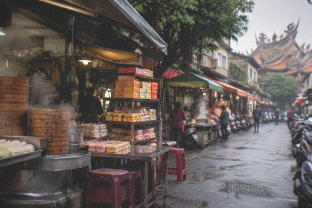 Boxes of traditional Taiwanese pastries stacked on a shop shelf