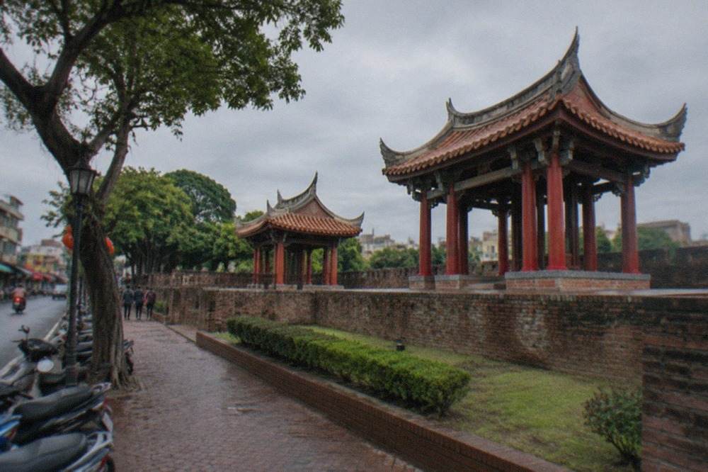 Old brick rampart walls of a historic fort under a wide sky in Tainan