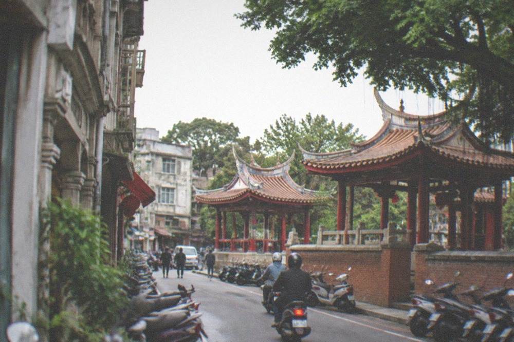 An old commercial building with colonial-era architecture on a city street