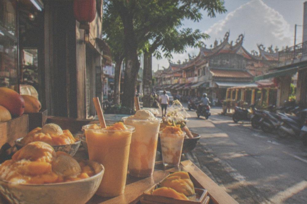 A dessert shop counter in Tainan with mango desserts and iced drinks on display