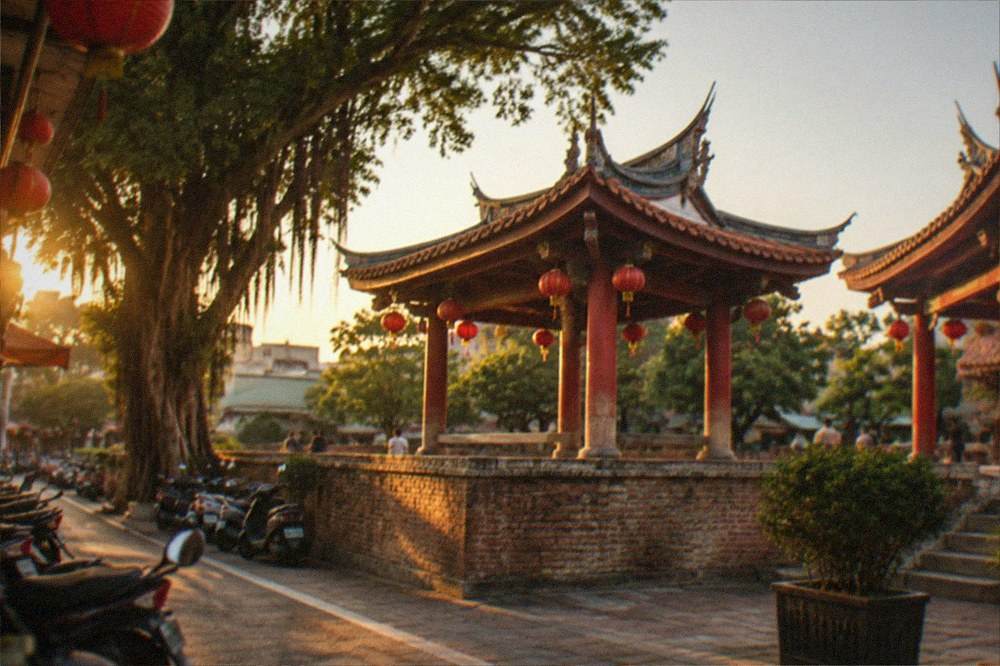 Lanterns and temple decorations under a clear evening sky in Tainan
