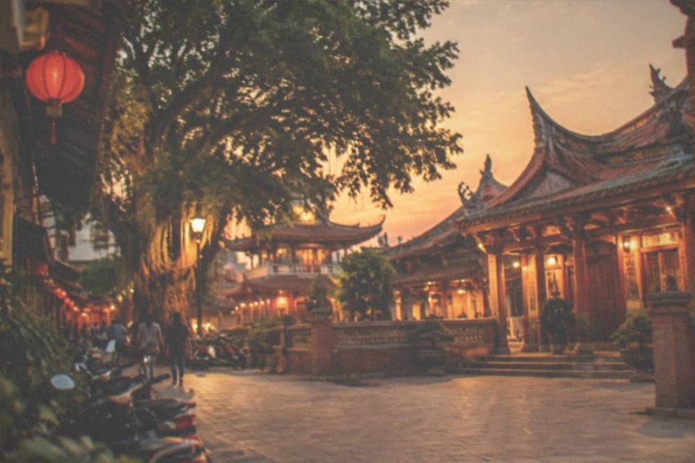 The illuminated Chihkan Tower courtyard at night with its Chinese pavilion buildings lit warmly