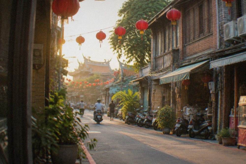Sunset light over historic brick walls and old rooftops in Tainan