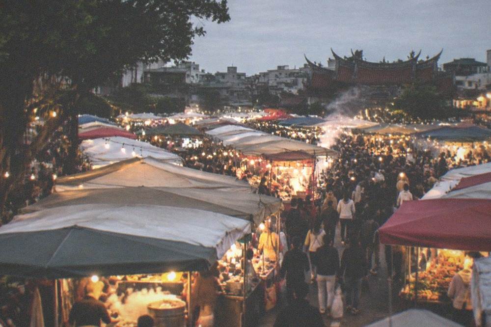 Steam rising from food stalls at a Tainan night market