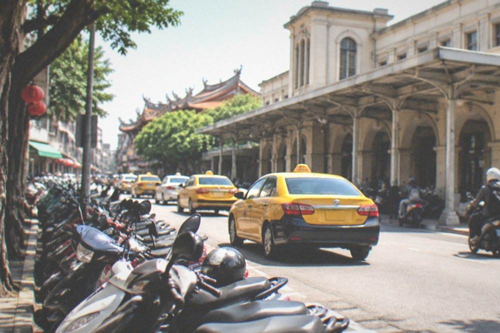 Scooters parked in rows beside Tainan railway station