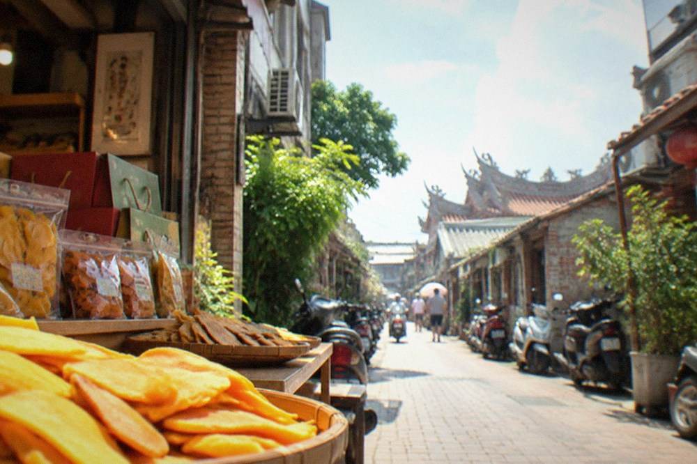 Dried mango slices and packaged fruit gifts displayed in a Tainan shop