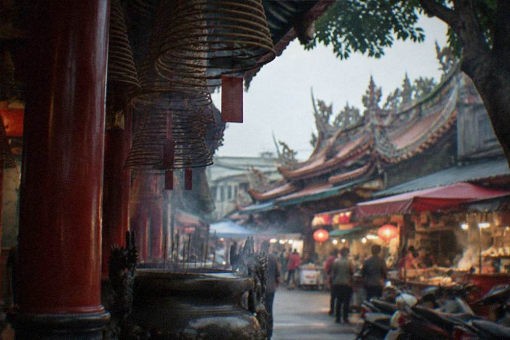 A night market street glowing with stall lights and food vendors in Tainan