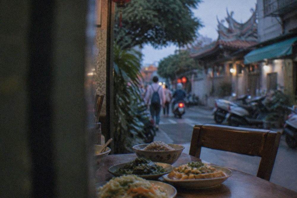 A table of vegetable and tofu dishes at a Taiwanese vegetarian restaurant