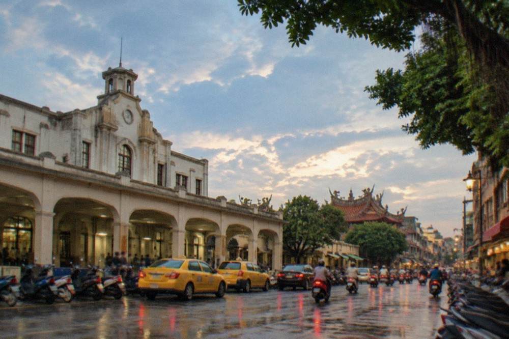A historic Tainan street lined with low buildings in the evening