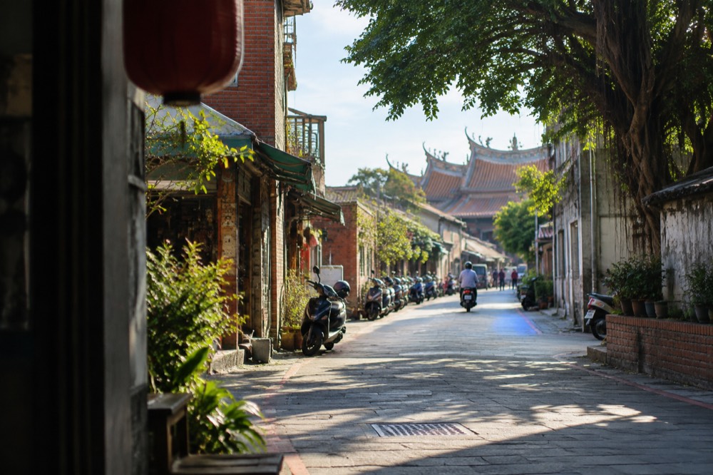 Narrow old street lane in Anping with low brick buildings and small shopfronts