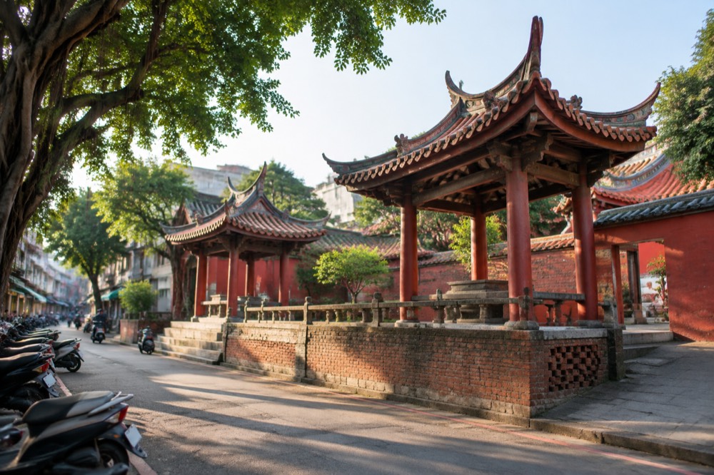 Red temple walls and traditional curved roof in central Tainan