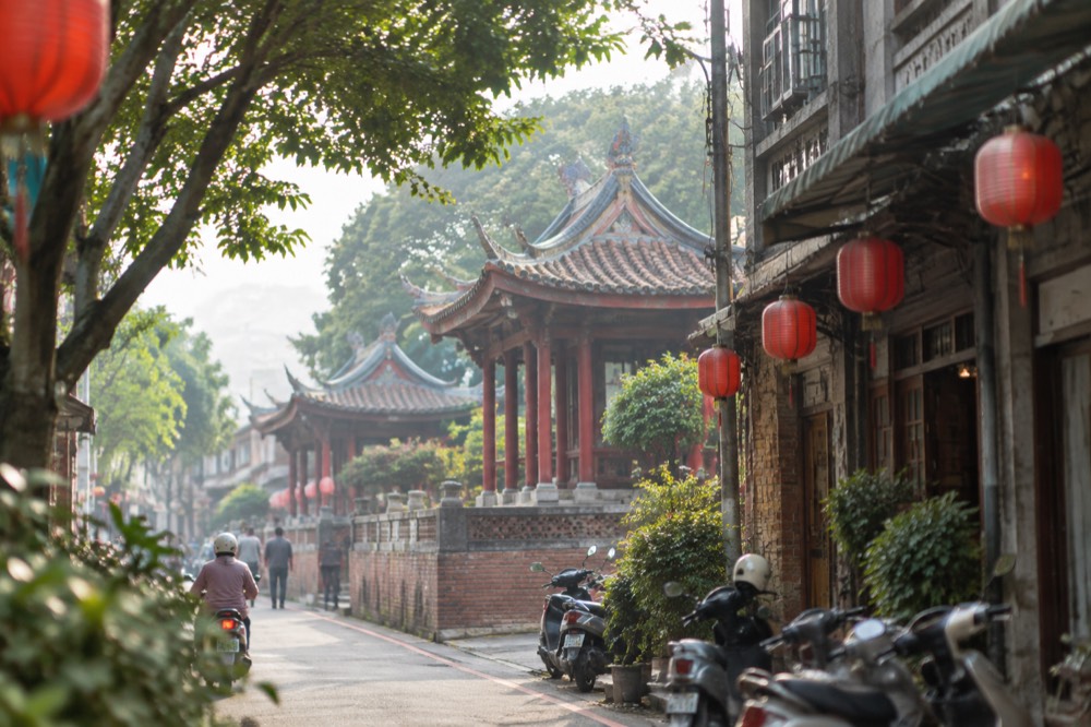 A restored old street facade in central Tainan with lanterns hanging over the pavement