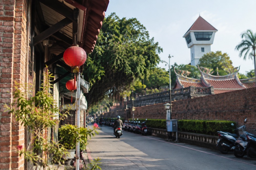 White lookout tower and old brick walls of Anping Old Fort