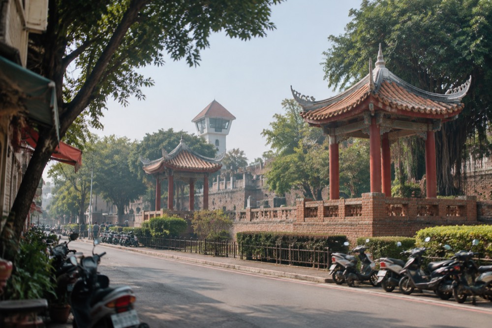 Historic brick walls and a lookout tower at an old fort in Tainan under a clear sky